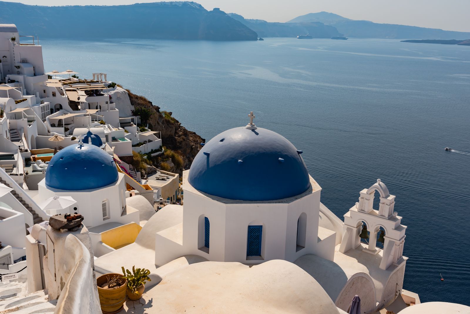 Blue-domed churches above the sea in Oia, Santorini